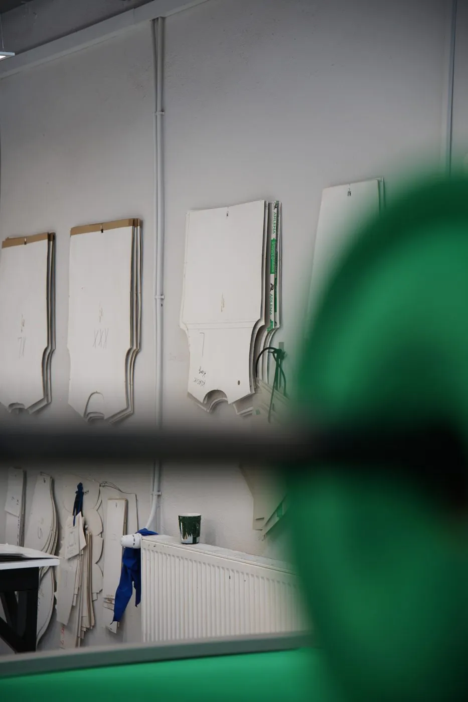 Pattern templates hanging on the workshop wall
